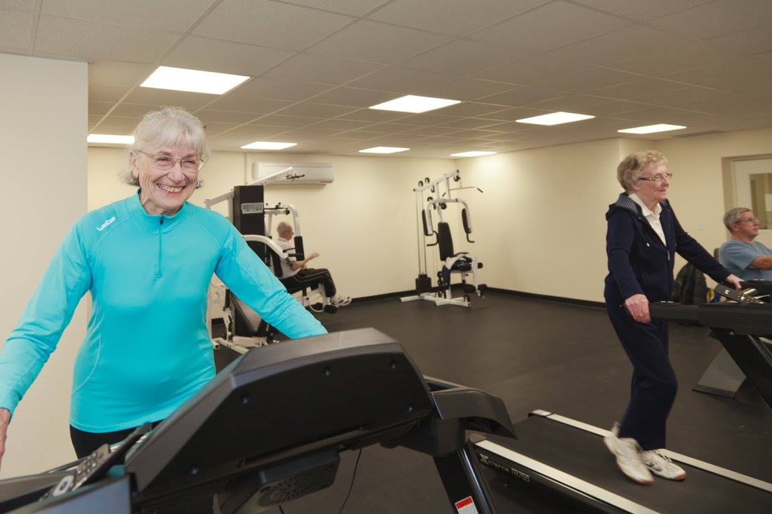 people walking on treadmills