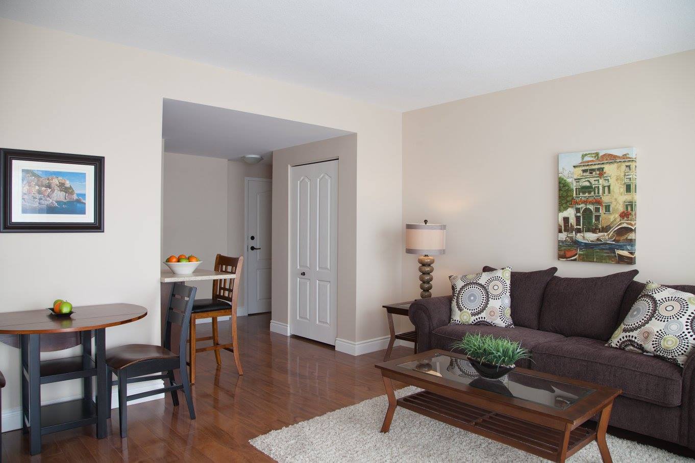 furnished living room and kitchen nook